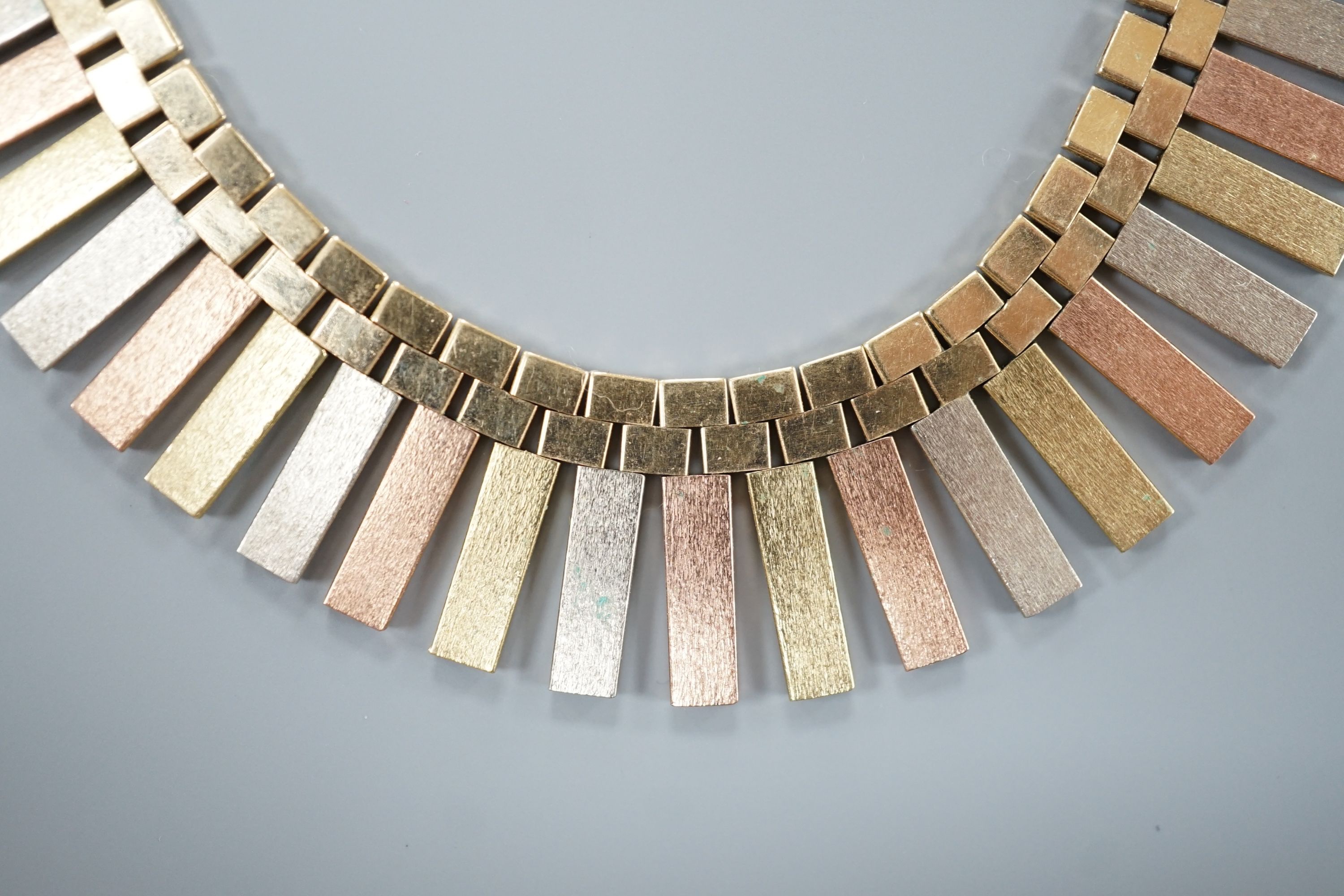 A modern three colour 9ct gold fringe necklace, 40cm, 46.7 grams.